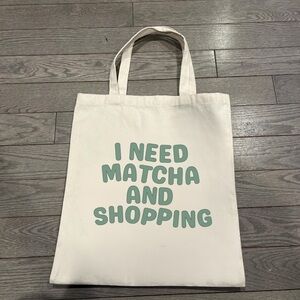 Trendy Cream Tote with Green Text